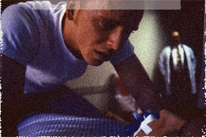 Michael (Joe McClean) examines his clone as the Doctor (Brian Tom O�Connor) observes.